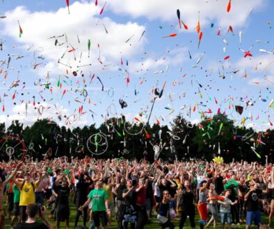 A large group of people juggling